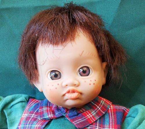 collectable small funny faced vinyl/cloth doll 25 cm