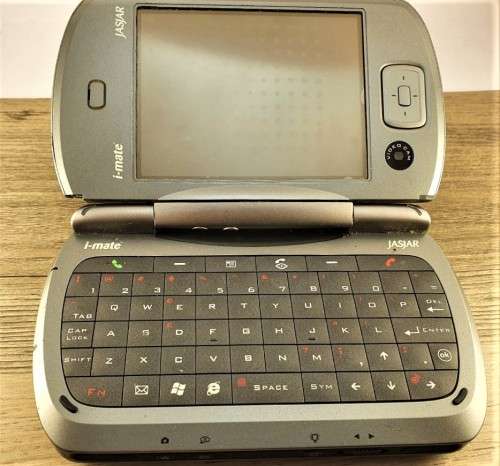 I Mate cell phone. In box. Working. From the mid 2000`s