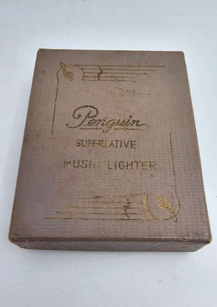 Vintage Penguin Music Lighter