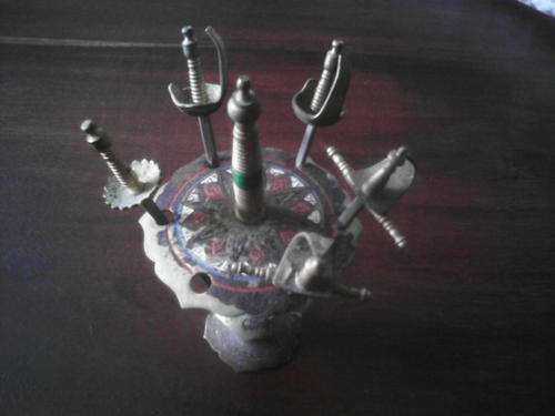 small stand with swords