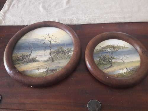 2 circular paintings