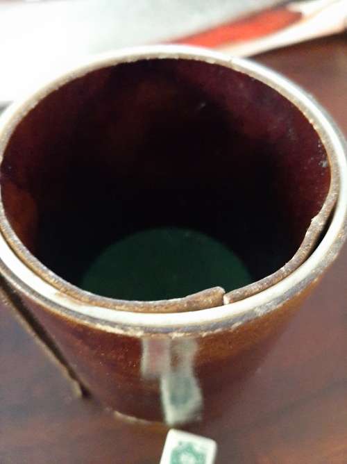 Poker dice in leather cup