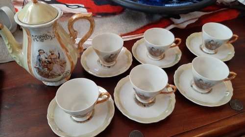 Tea set 6 cups and saucers and teapot