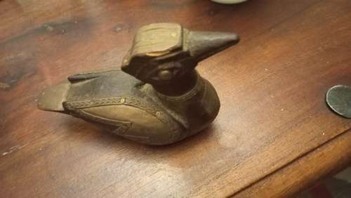 Wooden duck with brass