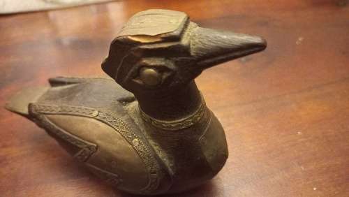 Wooden duck with brass