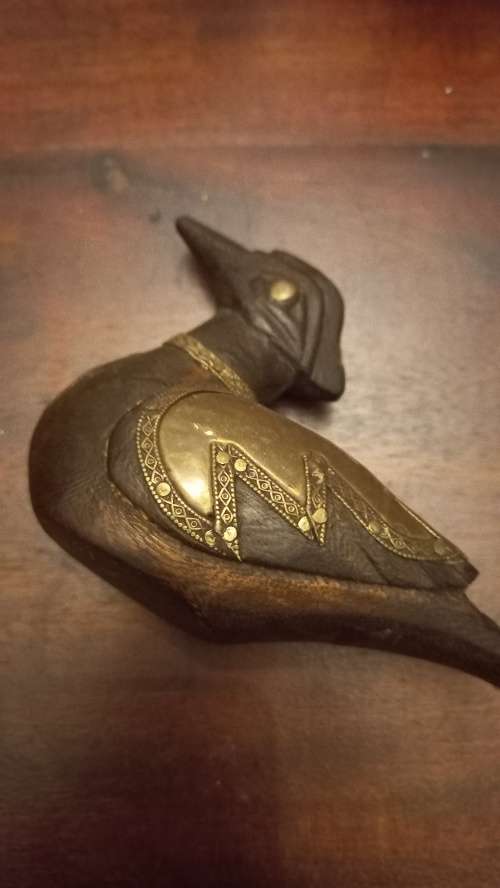 Wooden duck with brass