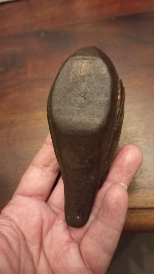 Wooden duck with brass