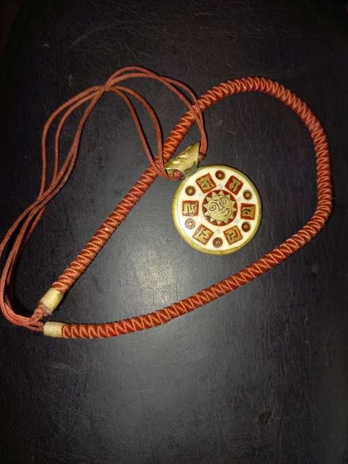 Sun bone and copper amulet vintage