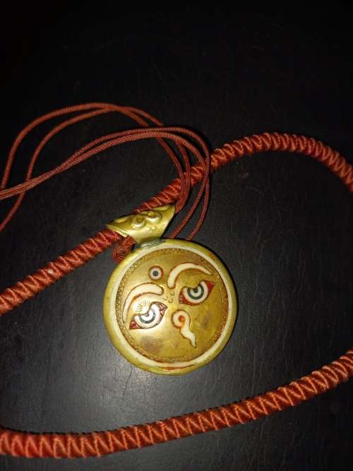 Sun bone and copper amulet vintage