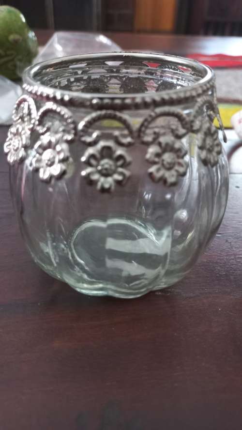 Glass jars with metal collars tea candle holders