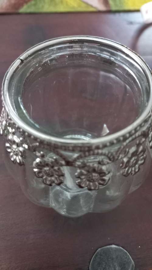 Glass jars with metal collars tea candle holders