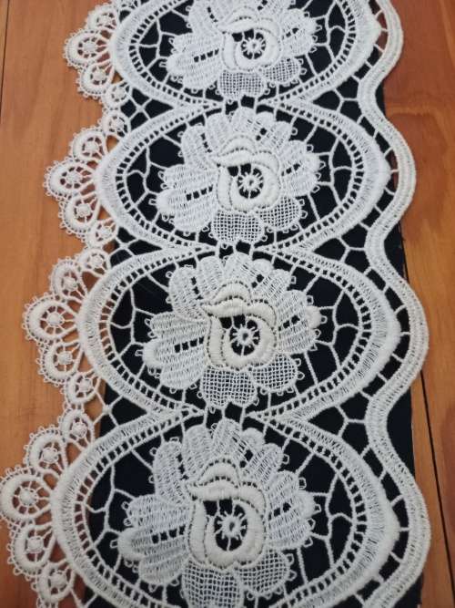 Vintage lace cloth with brass hanging