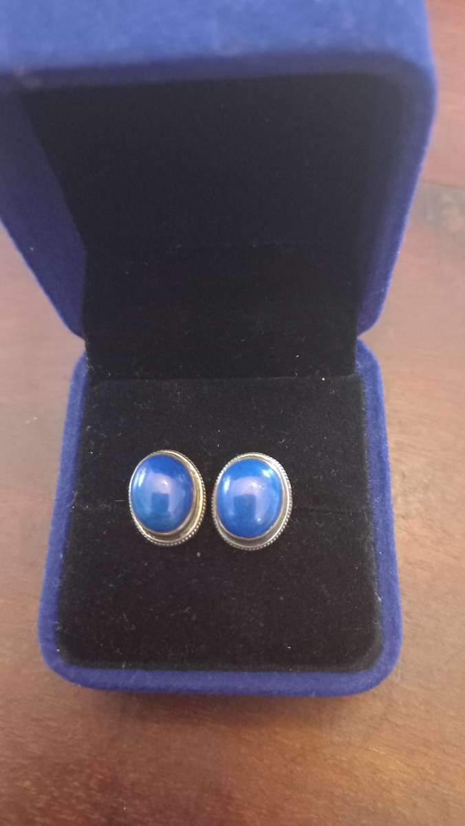 Sterling silver earrings with blue stone