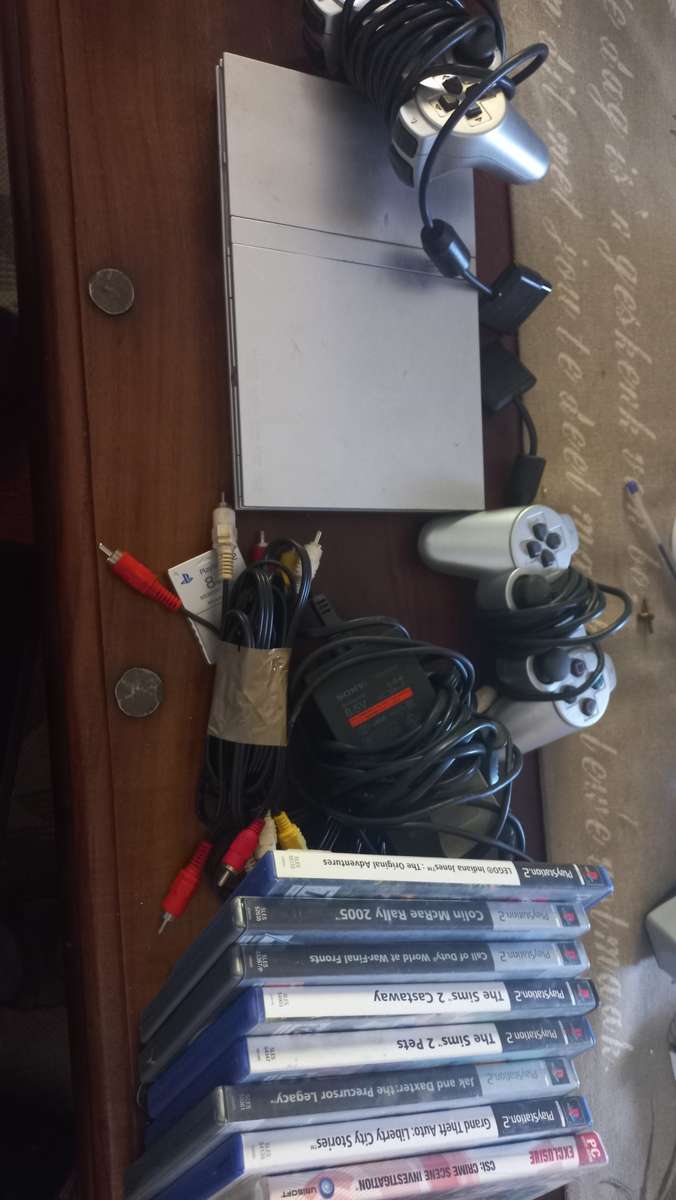 PS2 console with 8 games and 8mb card