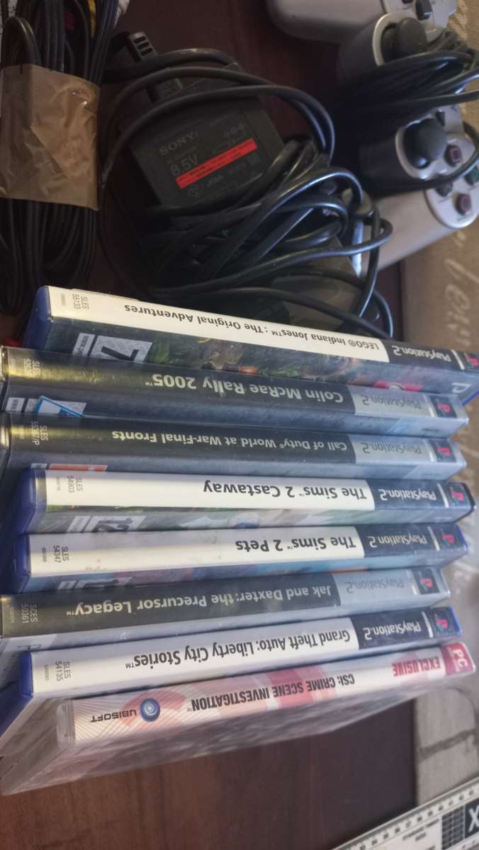 PS2 console with 8 games and 8mb card
