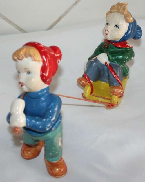 WOW COLLECTORS ITEM A AMAZING VINTAGE/ANTIQUE PORCELAIN/CERAMIC BOY PULLING A GIRL ON A SLAY