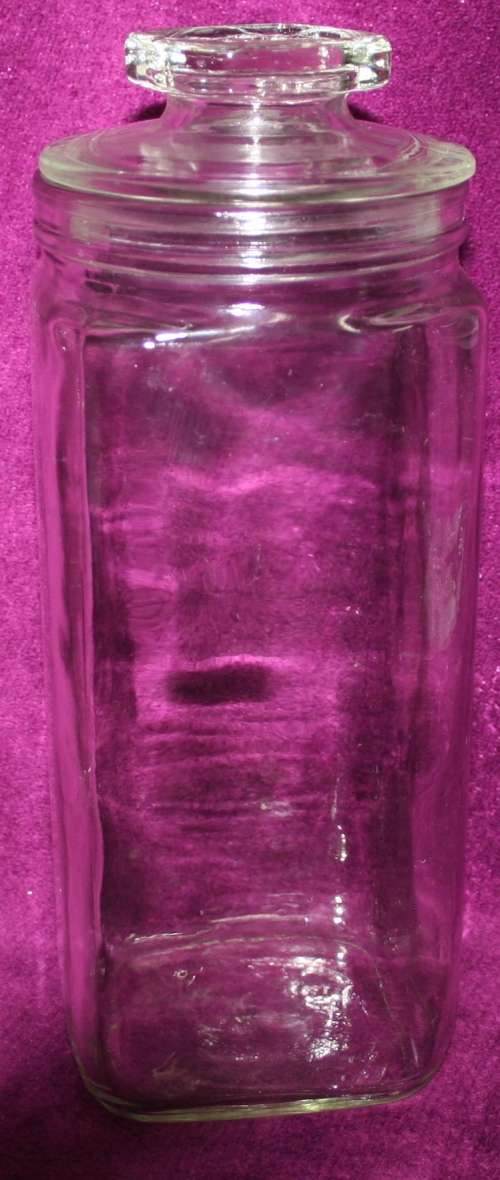 A STUNNING SQUARE TALL THICK GLASS COOKIE JAR WITH A LID