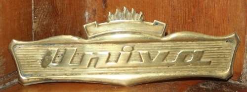 A VINTAGE BRASS UNIVA SIGHN