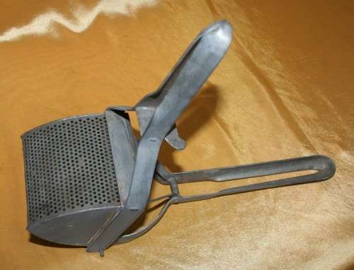 This kitchen utensil is a potato masher and fruit press strainer juicer ideal for your industrial or