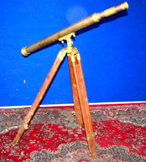 A STUNNING SOLID BRASS TELESCOPE ON A SOLID TEAK AND BRASS TRIPOD!!! AWESOME COLLECTIBLE!!!