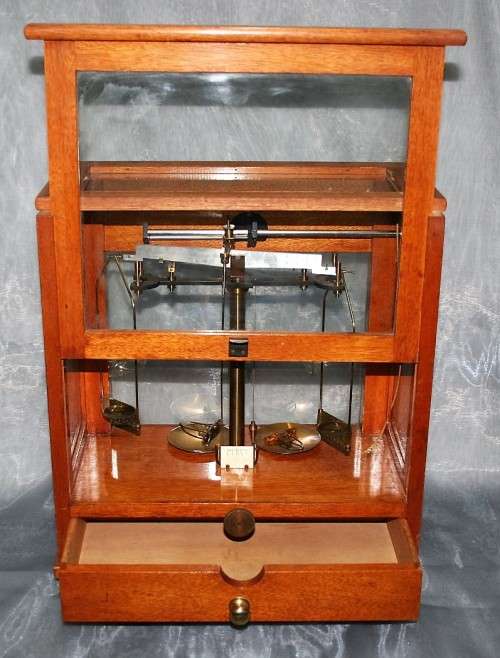 A SPECTACULAR ANTIQUE PRECISION DIAMOND SCALE IN A GLASS CASE WITH A RATCHET DOOR! EX-SAP SCALE!