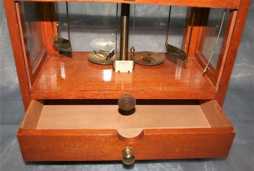 A SPECTACULAR ANTIQUE PRECISION DIAMOND SCALE IN A GLASS CASE WITH A RATCHET DOOR! EX-SAP SCALE!