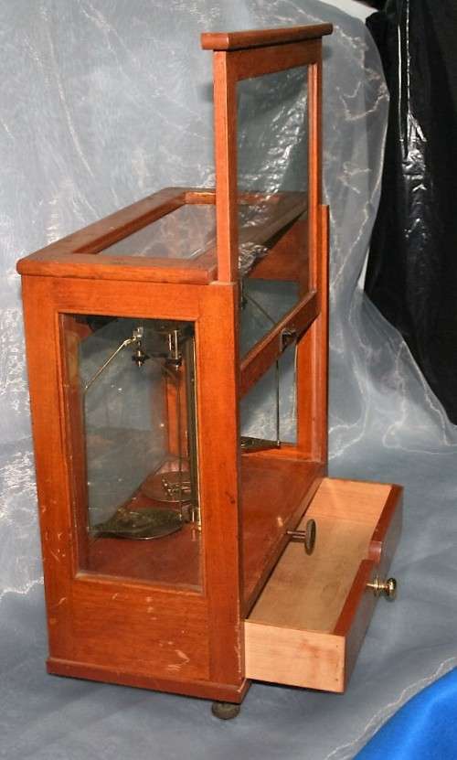 A SPECTACULAR ANTIQUE PRECISION DIAMOND SCALE IN A GLASS CASE WITH A RATCHET DOOR! EX-SAP SCALE!