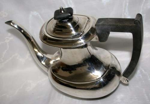A MARVELOUS - Sheffield teapot with bakelite handle and that really speaks to the art deco style!!!!