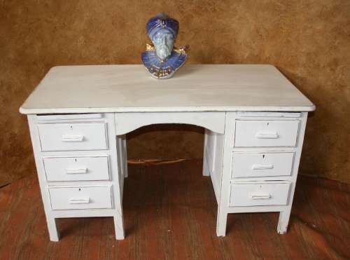 Here I have a charming shabby chic desk with 6 drawers.