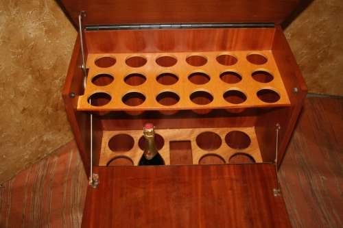 A MARVELOUS VINTAGE ART DECO STYLE LIQOUR CABINET ON ORIGINAL CASTERS SPACE FOR BOTTELS AND GLASSES