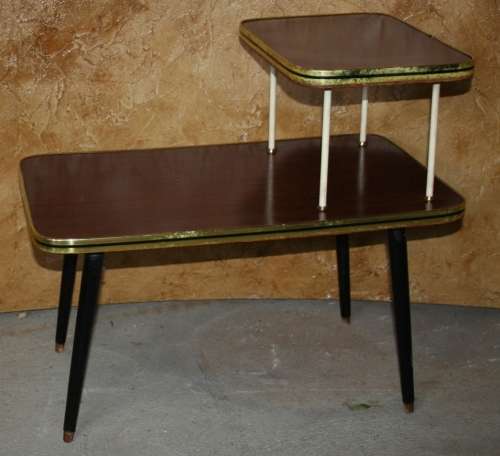 Vintage telephone table/stand. It features a gold colored legs & stunning retro chic tops.