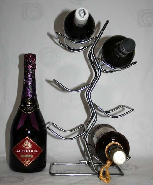 Here is a great, vintage, 5 bottle wine rack made out of Stainless steel. Stunning
