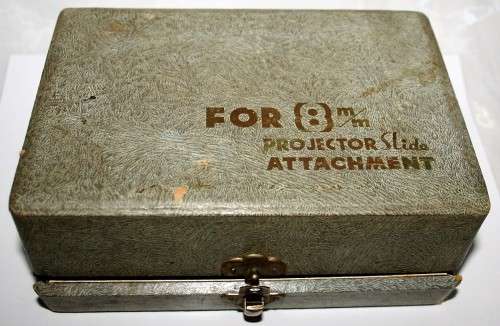 A vintage attachment FOR a 8'mm' PROJECTOR SLIDE ATTACHMENT