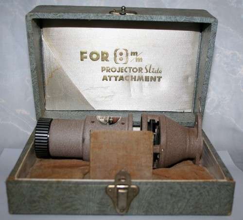 A vintage attachment FOR a 8'mm' PROJECTOR SLIDE ATTACHMENT