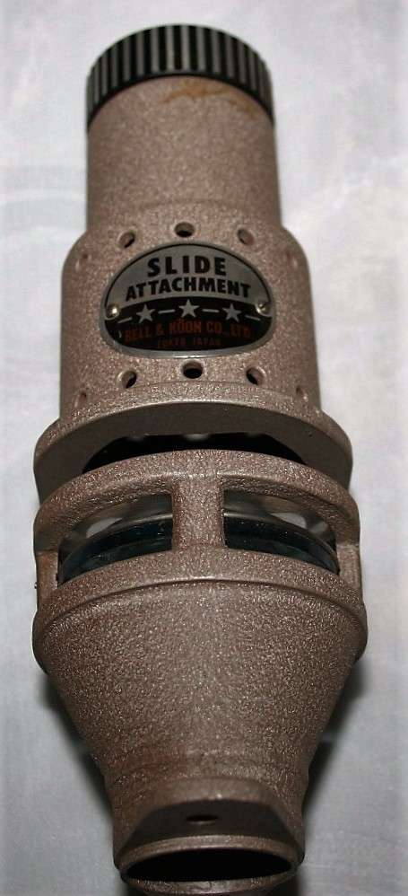 A vintage attachment FOR a 8'mm' PROJECTOR SLIDE ATTACHMENT