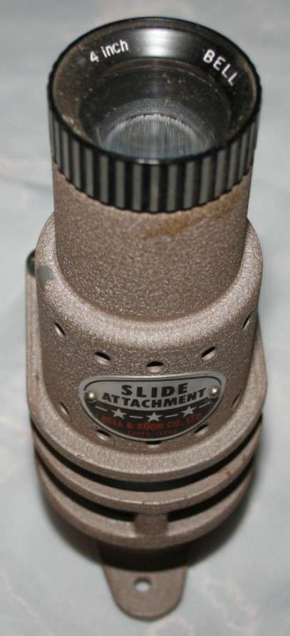 A vintage attachment FOR a 8'mm' PROJECTOR SLIDE ATTACHMENT