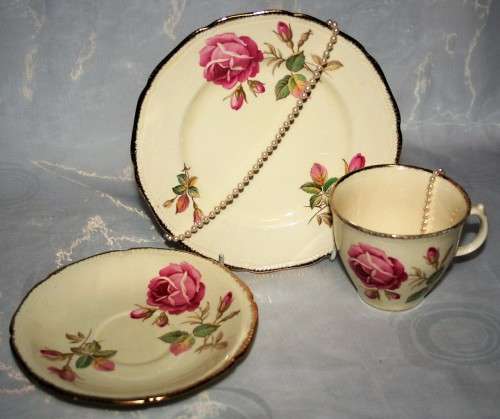 A Spectacular Royal Swan Trio Set. Beautiful creamy yellow background with gold roped edge around!