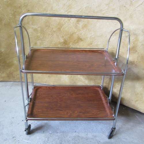 A marvelous Dinette vintage trolley table is one of the most practical serving tables,