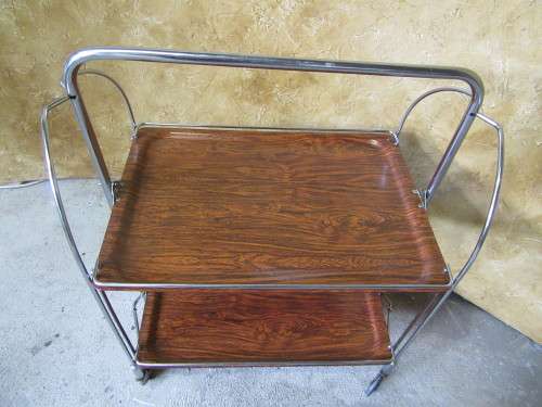 A marvelous Dinette vintage trolley table is one of the most practical serving tables,