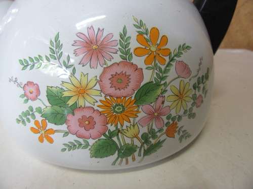 A Retro Floral Design Kettle this Enamelware Vintage Kettle is perfect for a vintage kitchen.