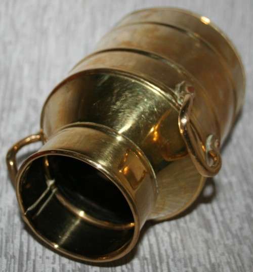 A gorgeous brass milk can clean and shiny will make a fantastic vase in that vintage shabby chic hou