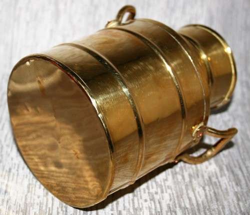 A gorgeous brass milk can clean and shiny will make a fantastic vase in that vintage shabby chic hou