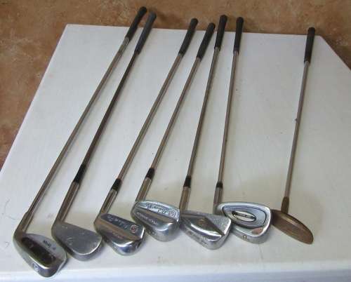 SEVEN GOLF CLUBS FOR BAR DECOR OR FOR THE KIDS TO PLAY WITH BID PER EACH