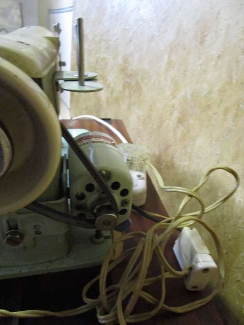 A VINTAGE BROTHER SEWING MACHINE IN A CUPBOARD IN WORKING CONDITION
