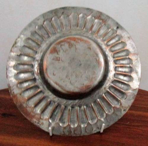 This is a fabulous retro copper plate with a stunning hammered motif .