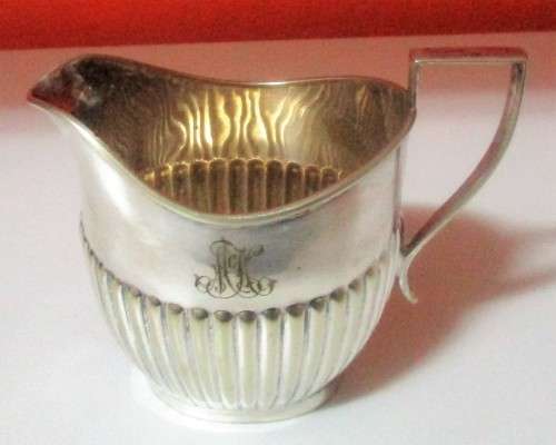 A MARVELOUS - Sheffield Style Milk Creamer that really speaks to the art deco style.