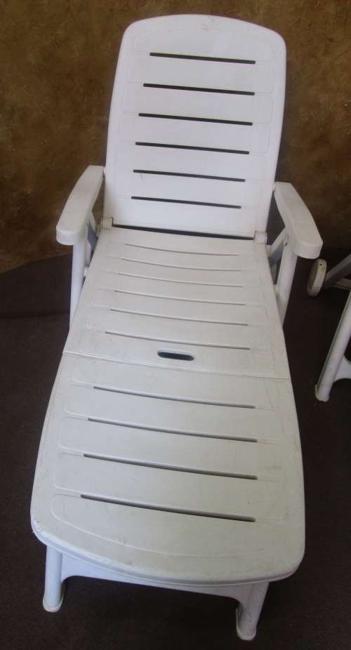 TWO FANTASTIC WHITE FOLD UP LOUNGERS ON WHEELS PERFECT FOR THIS SUMMER WEATHER BID PER EACH