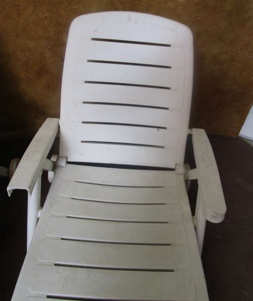 TWO FANTASTIC WHITE FOLD UP LOUNGERS ON WHEELS PERFECT FOR THIS SUMMER WEATHER BID PER EACH