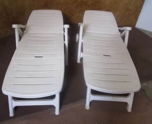 TWO FANTASTIC WHITE FOLD UP LOUNGERS ON WHEELS PERFECT FOR THIS SUMMER WEATHER BID PER EACH