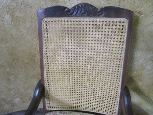 A GORGEOUS SOLID IMBUIA BOW BACKED BALL & CLAW ARM CHAIR WITH A RARE WEAVED RATTAN BACK